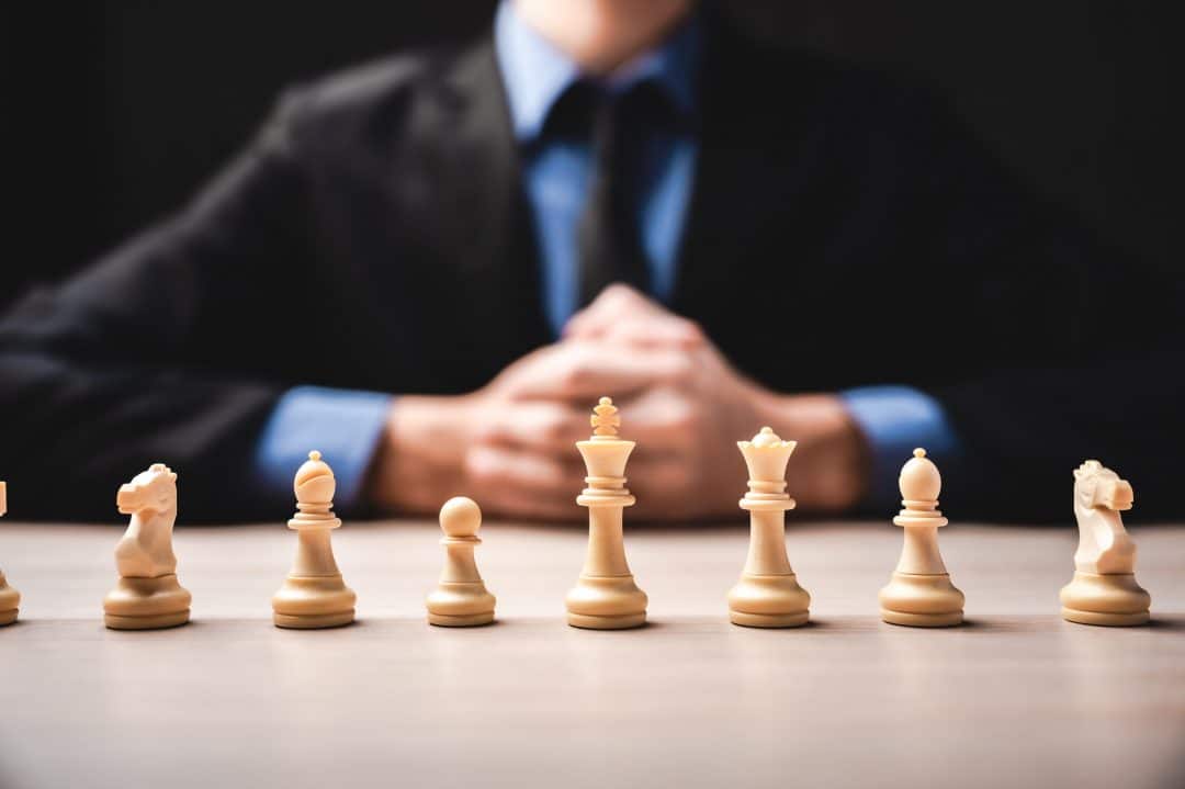 idea of winner business leadership and successful concept with chess pieces and businessman hand